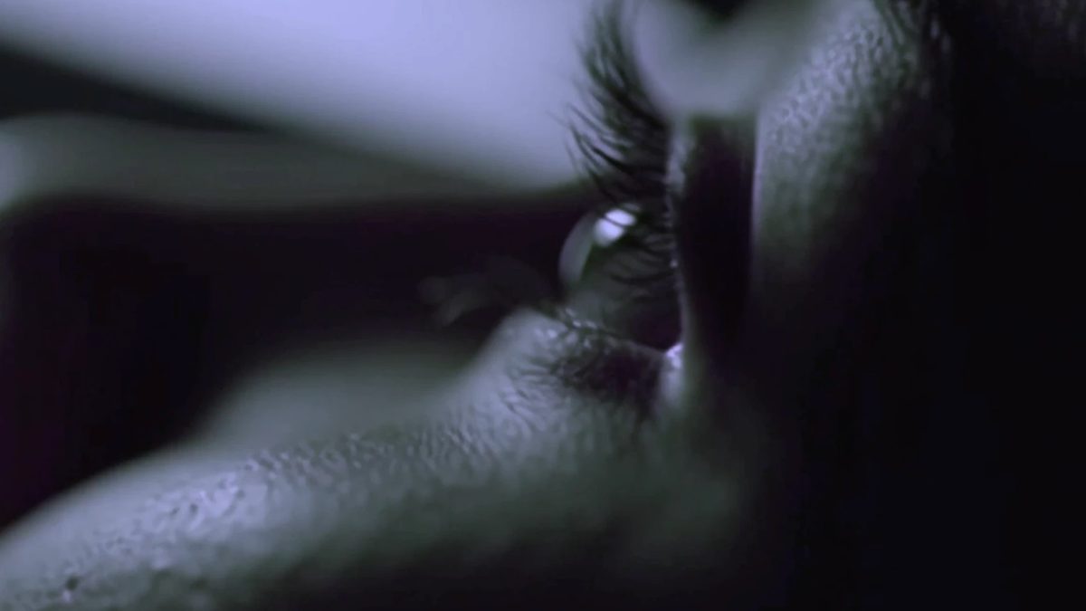 Held Still key art: an eye held open between two fingers